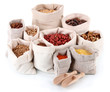 Different kinds of beans in sacks isolated on white
