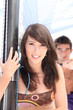 Photo: Young couple in sail boat Young couple in sail boat