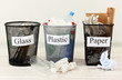 Three buckets of assorted debris on room background