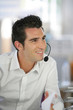 Foto: Businessman wearing a headset Businessman wearing a headset