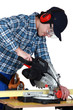 Man using a miter saw