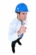 Photo: helmeted foreman with threatening look helmeted foreman with threatening look