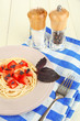 Spaghetti with tomatoes and basil leaves