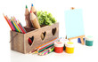 Different pencils in wooden crate, paints and easel, isolated