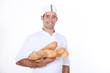 Baker with baguettes