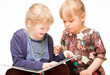 Photo: Children reading a book Children reading a book