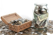The box with coins on isolated background