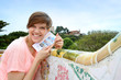 Portrait of cheerful girl visiting Barcelona