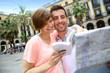 Tourists reading map in the Plaza Real of Barcelona
