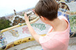 Girl taking picture of Barcelona from Guell Park