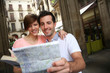 Tourists standing near the Plaza real of Barcelona