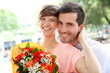 Girl receiving flowers from boyfriend