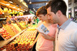 Couple in la Boqueria market in Barcelona