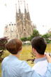 Tourists looking at the Sagrada Familia church