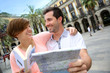 Tourists reading map in the Plaza Real of Barcelona