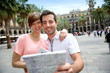 Tourists reading map in the Plaza Real of Barcelona