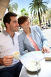 Couple in Barcelona sitting at restaurant table in Plaza Real