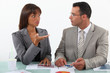 Photo: Colleagues commenting statistics Colleagues commenting statistics