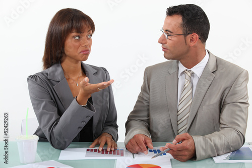 Photo: Colleagues commenting statistics Colleagues commenting statistics