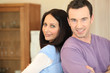 Photo: couple standing back to back couple standing back to back
