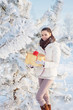 girl with gift in winter park
