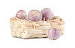 Several garlic in a wicker basket isolated on white