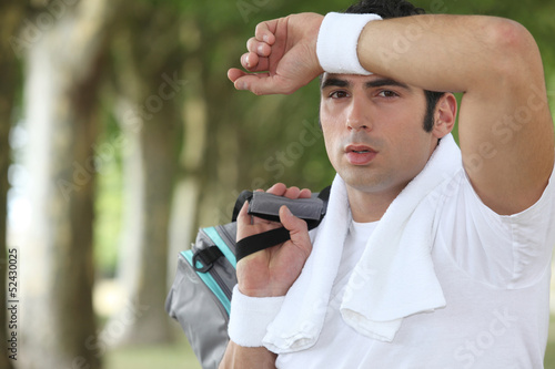 Photo: Man wiping sweat from his brow Man wiping sweat from his brow