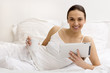 Young girl using  tablet on bed