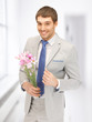 handsome man with flowers in hand