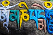 Tibetan buddhist religious symbols on stones