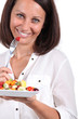 Photo: Woman with bowl of fruit Woman with bowl of fruit