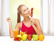 woman with organic food eating strawberry