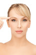 woman touching her face skin
