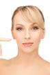 woman pointing at her face