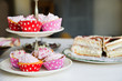 Cupcakes and birthday cake on a table