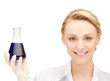 female chemist holding bulb with chemicals