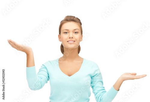 Photo: measuring something on the palms of her hands measuring something on the palms of her hands