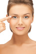 woman touching her face skin