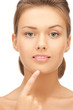 woman touching her chin