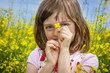 happy little girl with colza flower