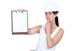 Photo: Woman with clip-board making shush gesture Woman with clip-board making shush gesture