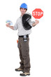 Electrical workerholding stop sign