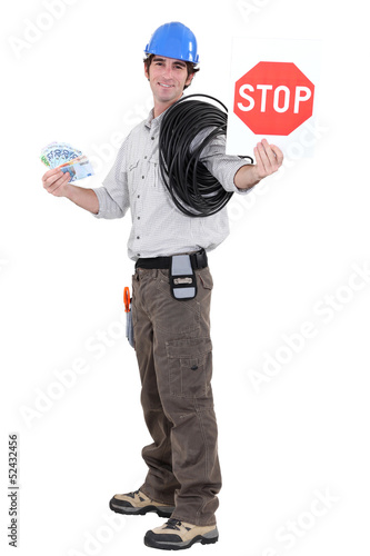 Photo: Electrical workerholding stop sign Electrical workerholding stop sign