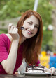 Style redhead girl with cake and cup
