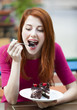 Style redhead girl with cake and cup