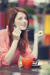 Style redhead girl with cake and cup
