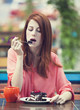 Style redhead girl with cake and cup