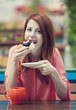 Style redhead girl with cake and cup