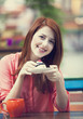 Style redhead girl with cake and cup