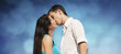 Beautiful couple kissing on blue sky background
